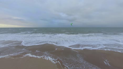fast and wide orbit shot around a kitesurfer in the netherlands