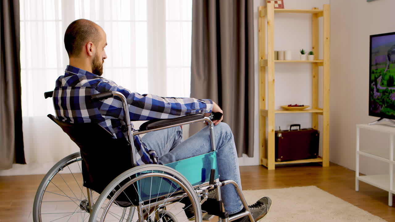 Thoughtful man watching TV