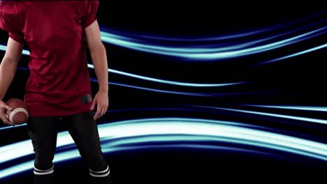 jugador de fútbol americano sosteniendo la pelota sobre los senderos de luz