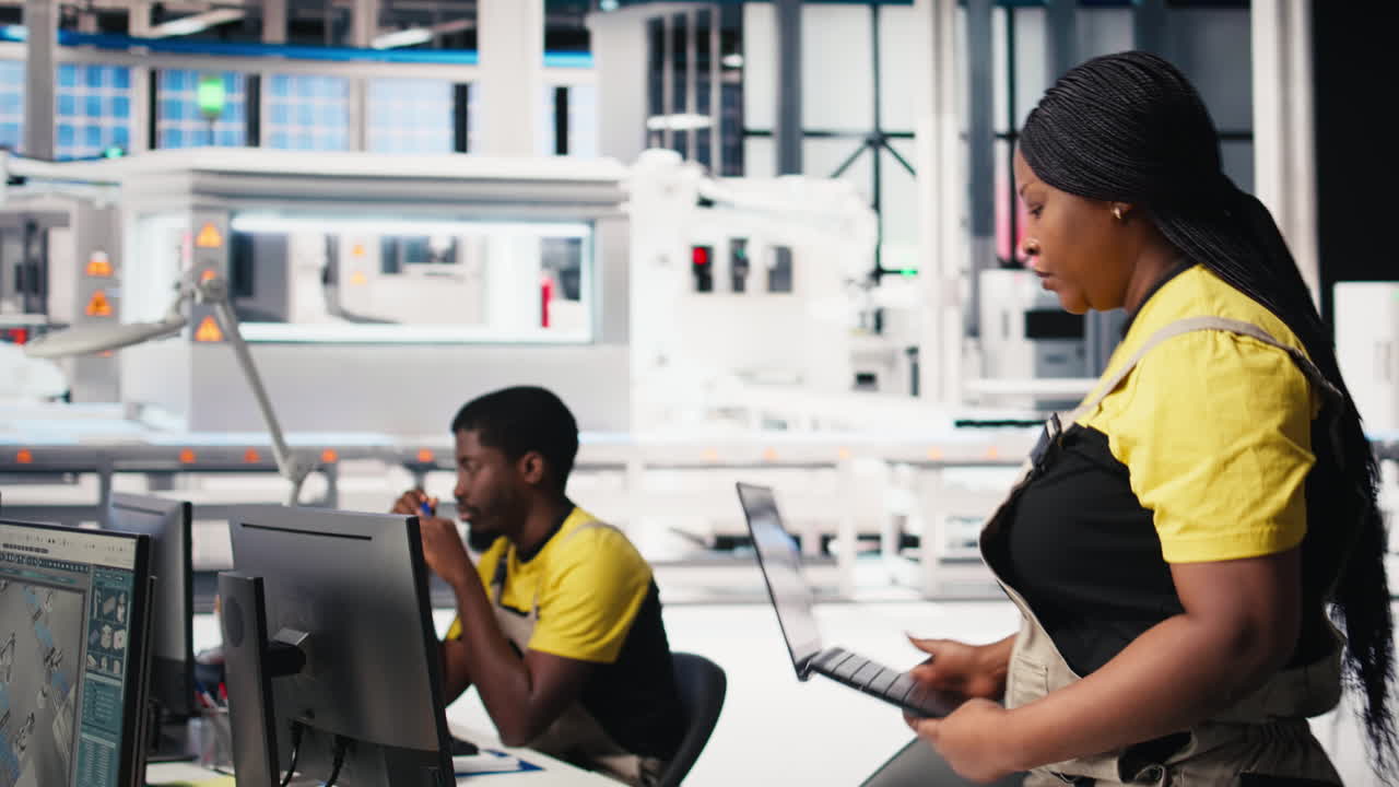 Vertical Video Black woman technician testing solar panel designs on industrial software