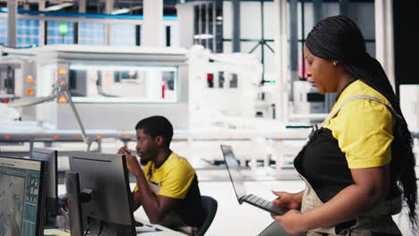 vertical video black woman technician testing solar panel designs on industrial software