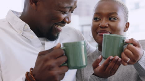 Happy-black-couple-drinking-coffee