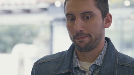 medium shot of a man receiving a sample of ice cream at an ice cream parlor. his face conveys emotion and fond memories, evoking moments from the past.