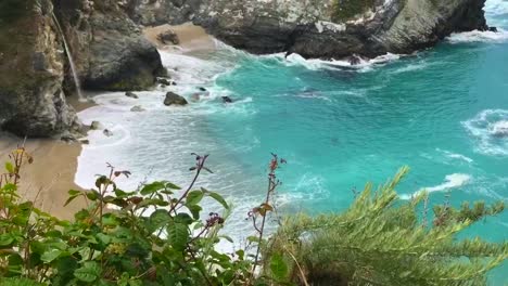 a dreamy beach waterfall called mcway falls in big sur, california