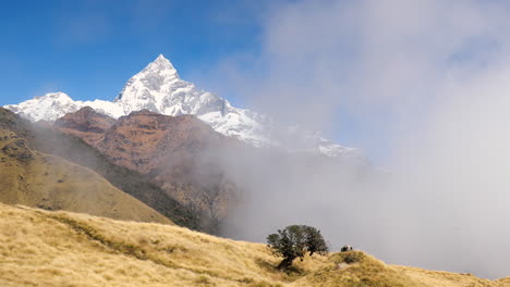 mt fishtail slowly covered by incoming clouds