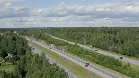 expansive aerial view of a motorway in the countryside of kerava, finland