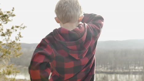 toddler looking out over valley during bright sunny day