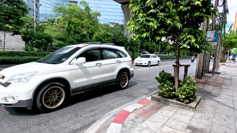 cars and motorbikes on a bangkok street