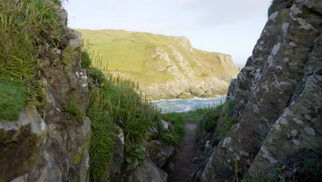 coastal path through rocky cliffs