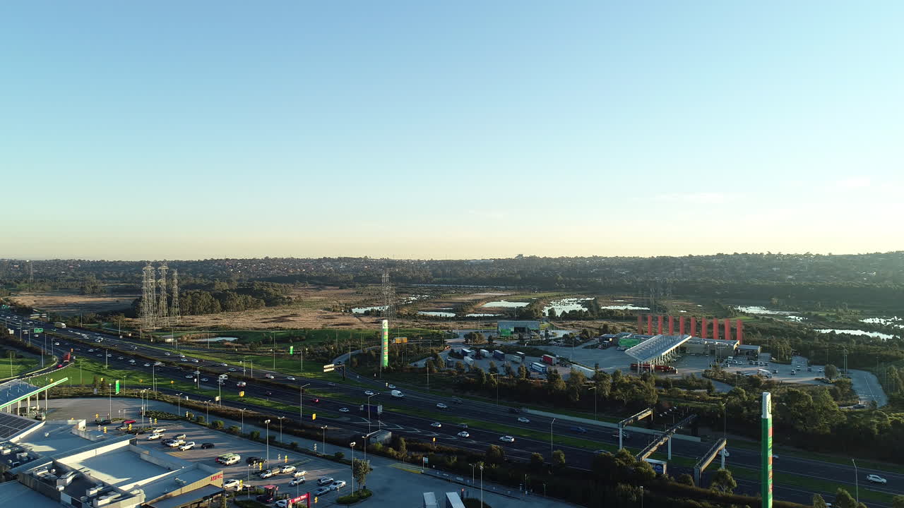 Static aerial perspective of traffic moving along Eastlink tollway from high above.