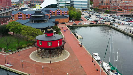 aerial: seven foot knoll lighthouse and the pier 5 waterfront garden in baltimore