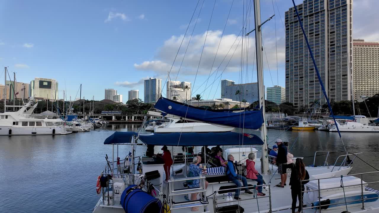 Catamaran Sailing Tours in Honolulu. Catamaran boat parked on the shore for tourist early morning whale watching tour in oahu hawaii island. Ala Wai Boat Harbor in Waikiki Honolulu Oahu Hawaii