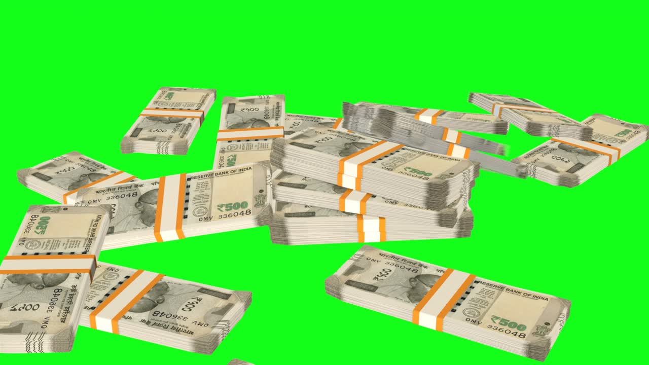 Many wads of money falling down on chromakey background. 500 Indian Rupees banknotes.