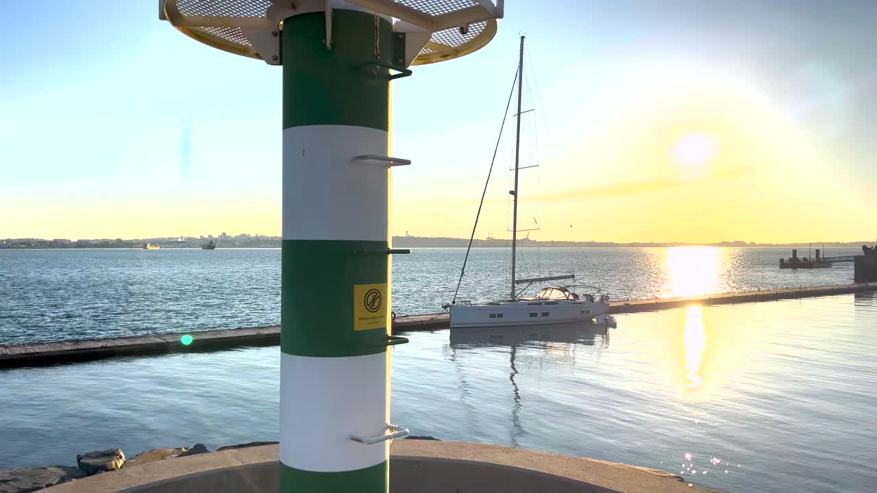 Golden sunset over Setubal's tranquil marina