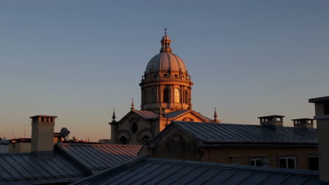 sunrise over a historical church in a city