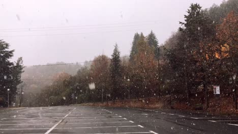 first snow on a mountain parking lot