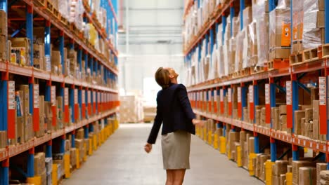 female manager looking at warehouse