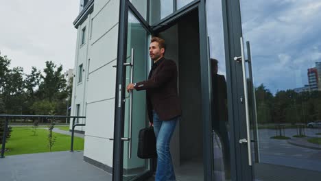 businessman leaving office building