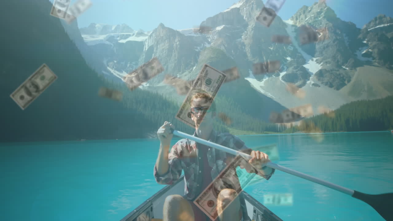 백인 남자가 호수에서 카누를 타고 떨어지는 미국 달러 지폐의 애니메이션
