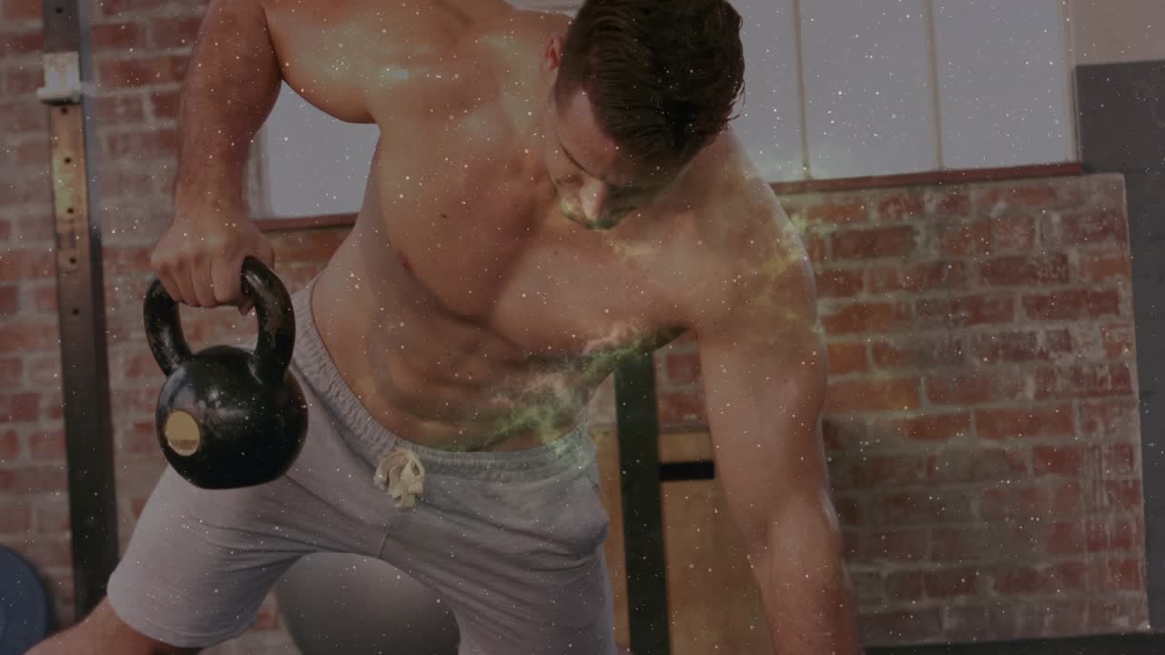 Athlete lifting kettlebell and starting row in gym, green nebula overlay obscuring body