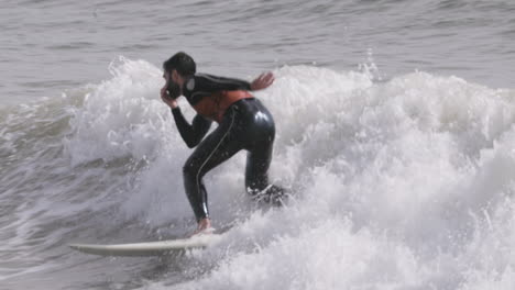 male surfer riding a wave