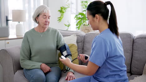 Blood-pressure,-test-and-caregiver-help-senior
