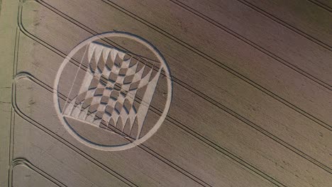 drone aerial footage showing fake ufo crop circles on a field of grain near micheldever station, united kingdom