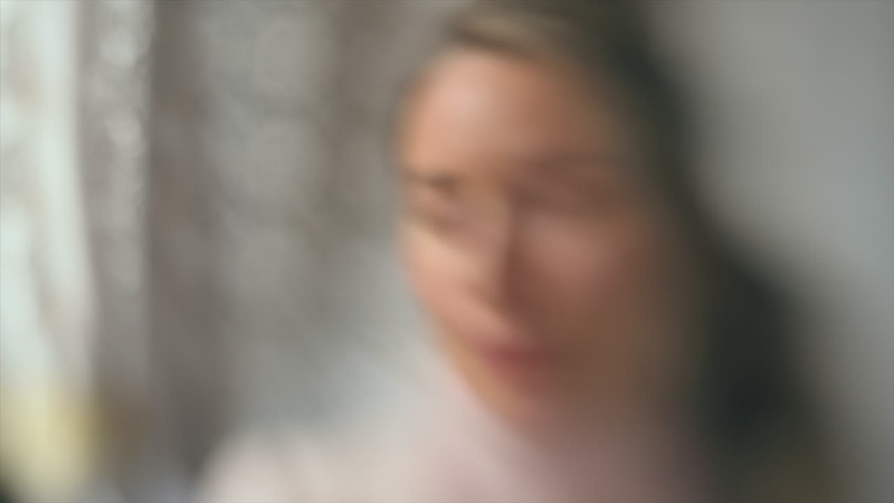 Blurred view of a woman moving her head
