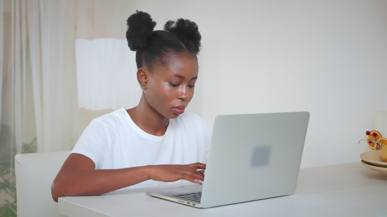 Woman working on laptop at home
