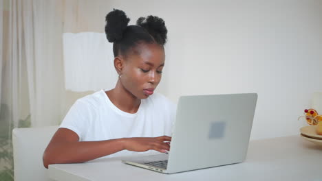 woman working on laptop at home