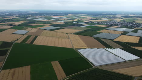 aerial view of agricultural fields and greenhouses