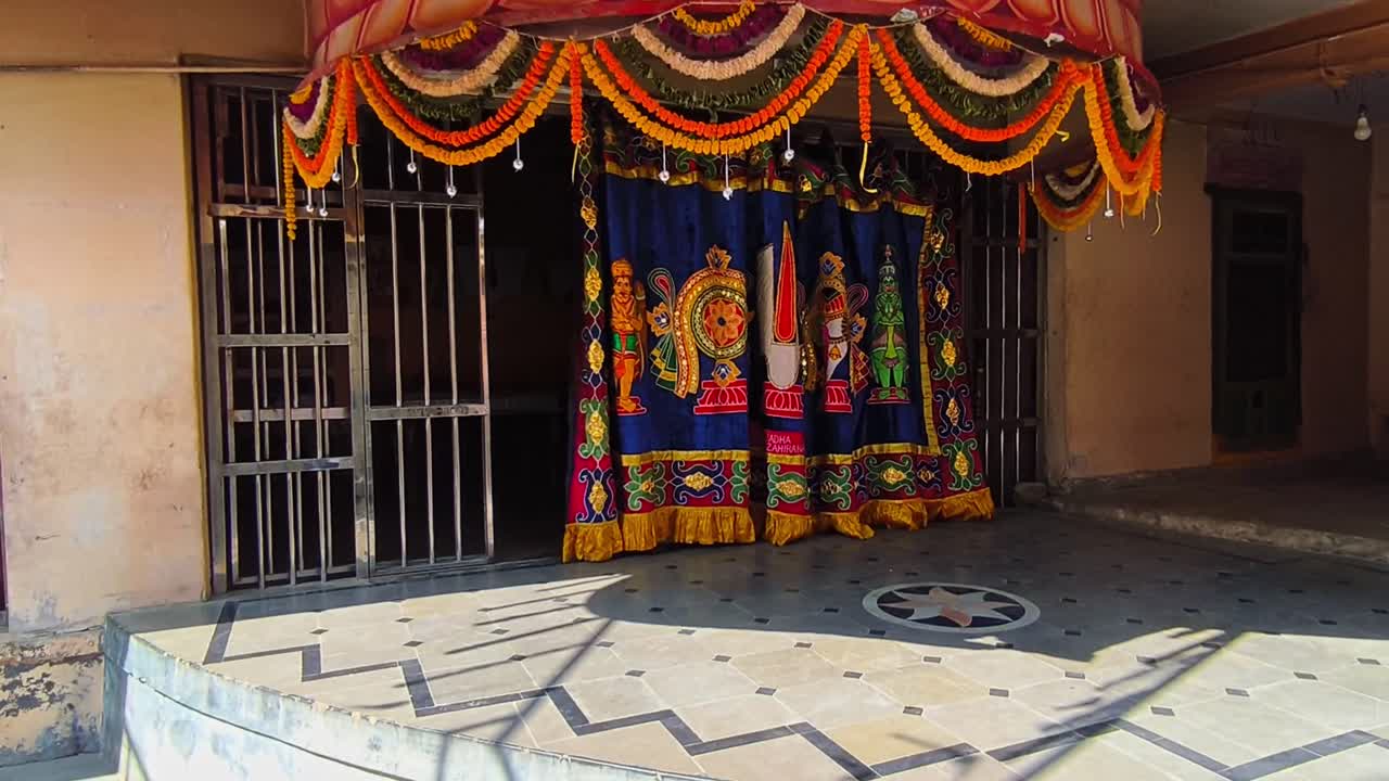 shanku chakra namam design on cloth it's using in hindu temples at kodangal. day time, stable shot, 4k