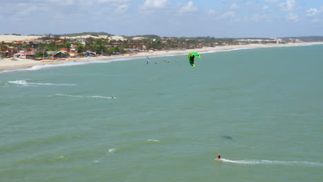 Aerial-view-of-people-practing-kite-surf,-Cumbuco,-Ceara,-Brazil