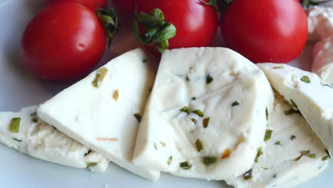 sliced white cheese with cherry tomatoes