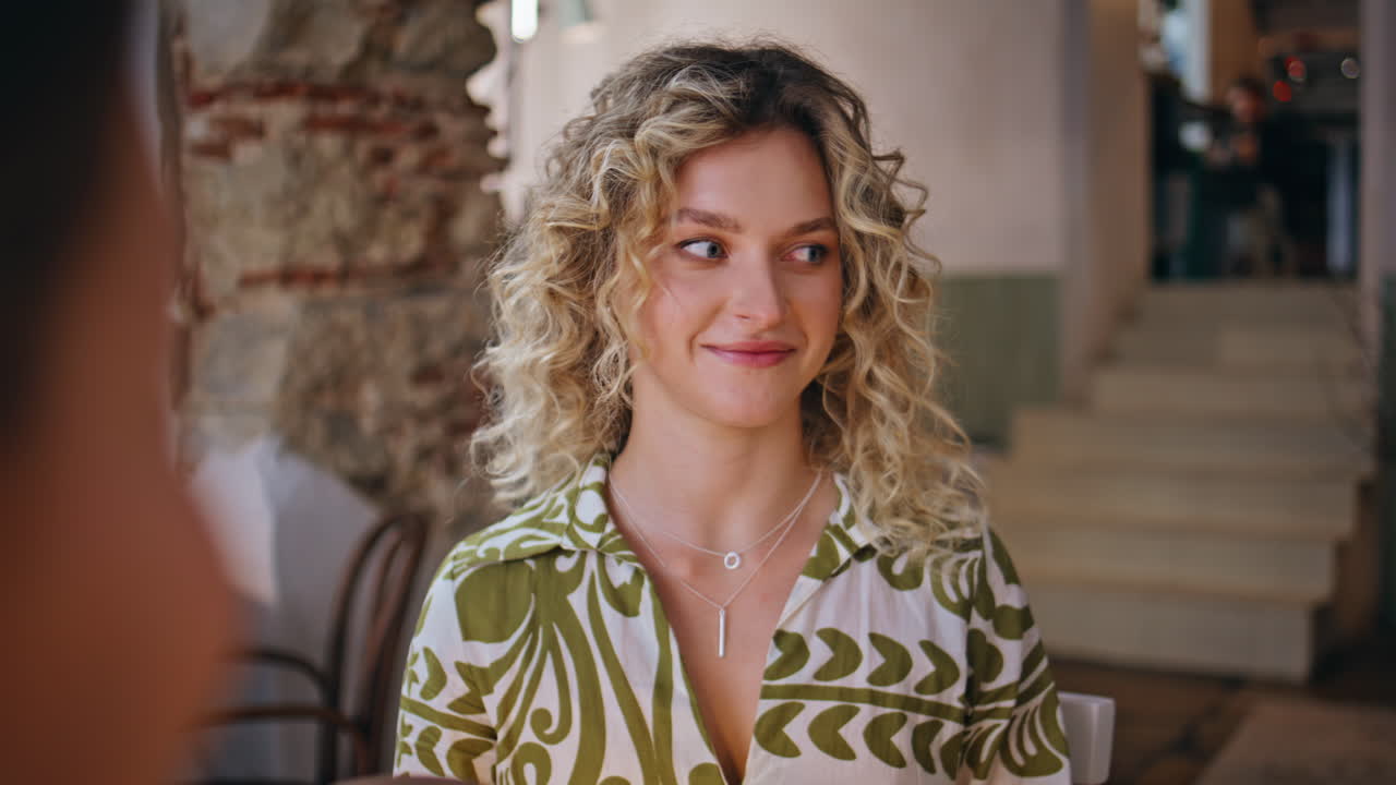 Girl sharing news friends sitting cafeteria table together closeup. Curly blonde