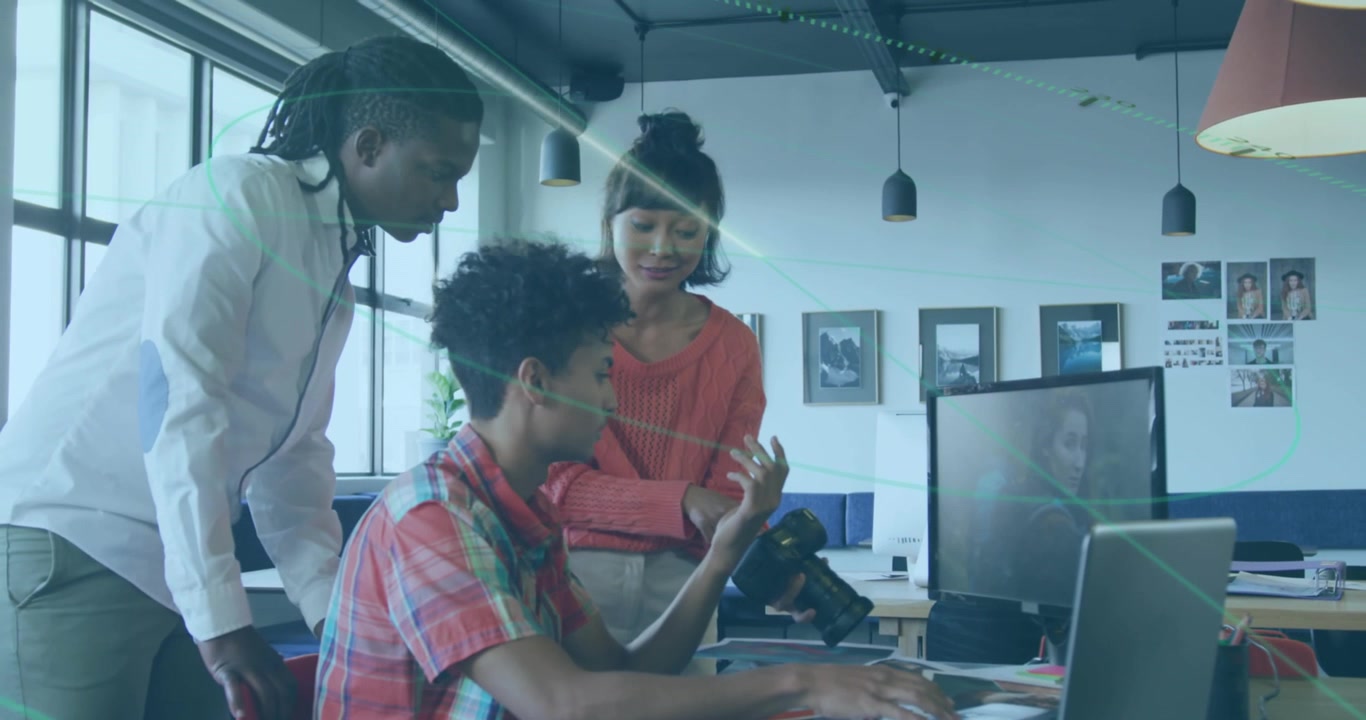 A group of diverse business people are discussing work during a meeting at the office