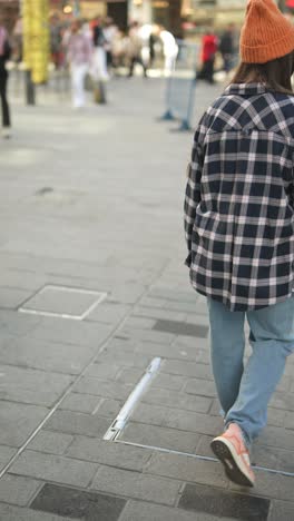 woman walking in a city street