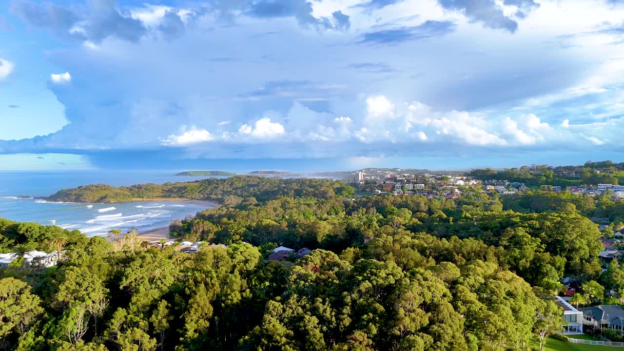 Coastal Cityscape with Lush Foliage and Stunning Ocean Views