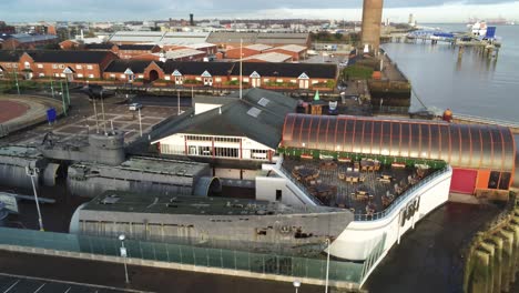 woodside ferry village terminal aerial view birkenhead over broken dismantled war ship pigeons fly through shot