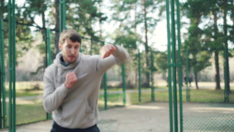 man boxing training outdoors