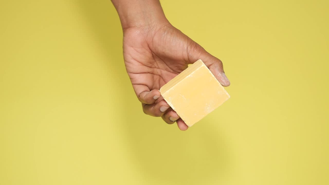 Hand holding a bar of soap