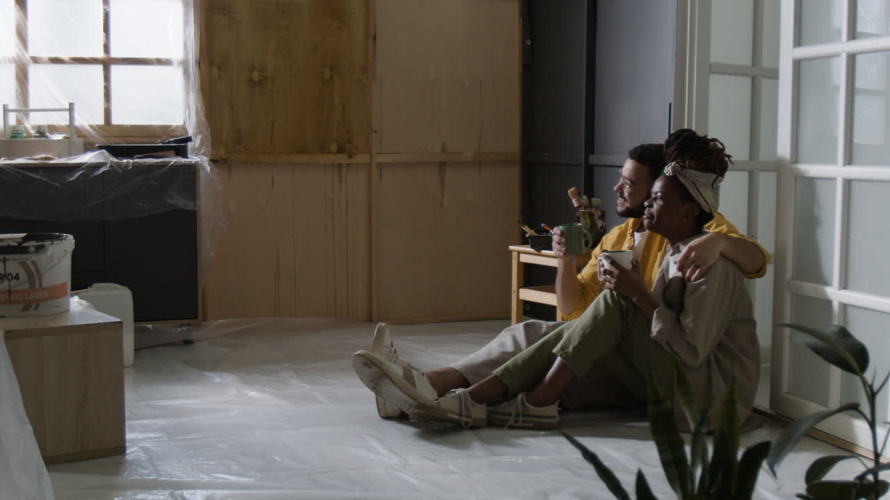 Couple Taking a Break During Home Renovation