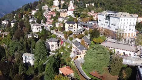 beauty of italian village of brunate situated on forestry mountain, aerial view