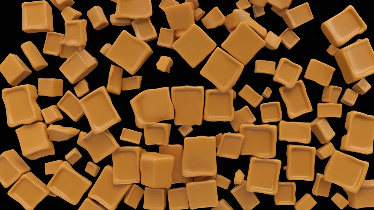 Cubi di caramello che cadono su sfondo nero