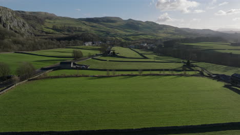 establishing drone shot of yorkshire dales fields and landscape stainforth
