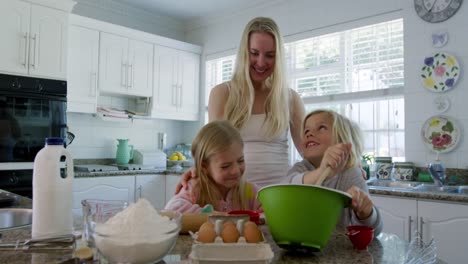 family making christmas cookies at home