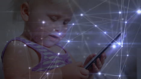 animation of networks of connections with icons over toddler using smartphone