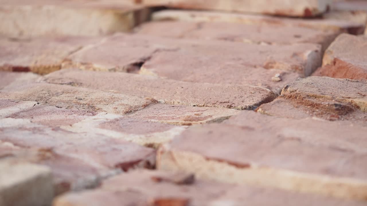 Close-up view of stacked red bricks