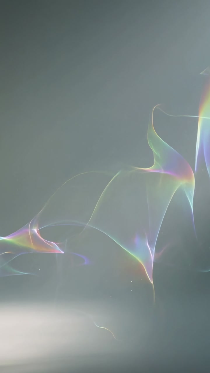 Vertical video: Light moving rainbow ribbons up-right on gray, prism edge soft left band for design