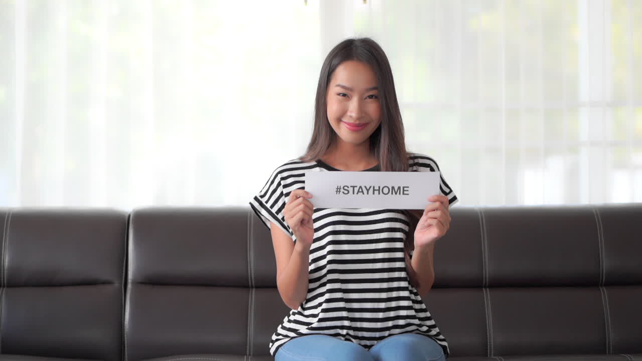 Asian lady spreading coronavirus awareness at home